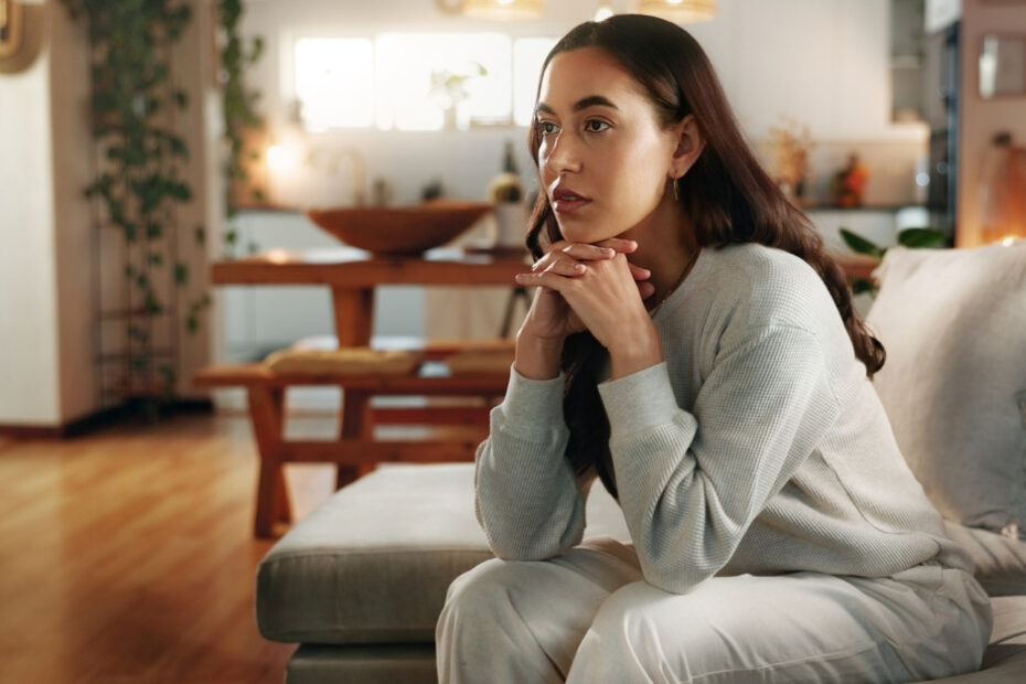 Pensive woman at home thinking about NSW Workers Compensation Law Changes 2025 will affect her compensation claim